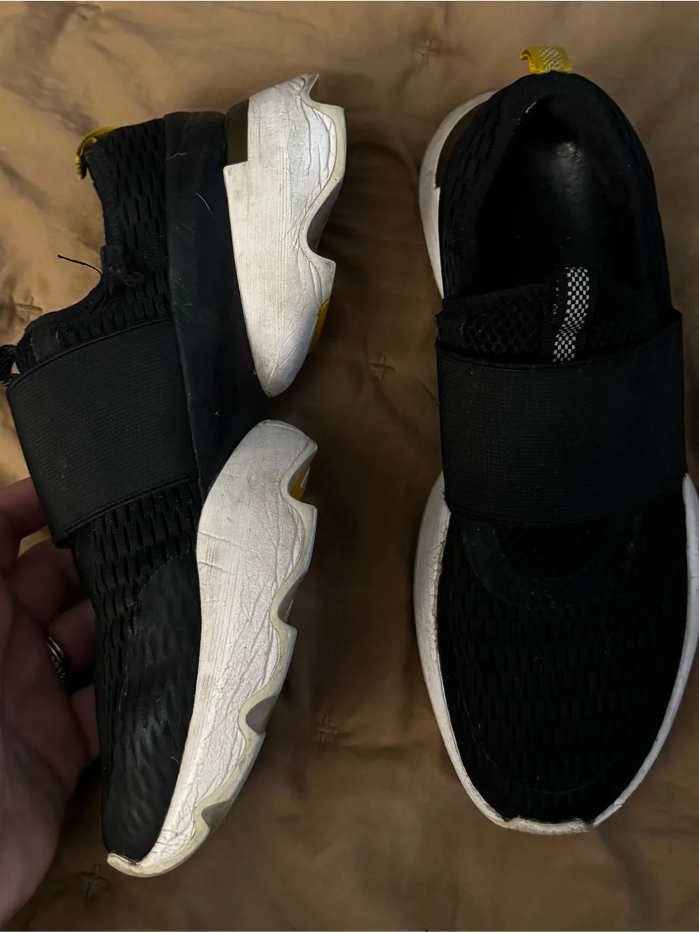 Sorel Black Slip-On Athletic Sneakers with White Soles and Yellow Heel Tab
